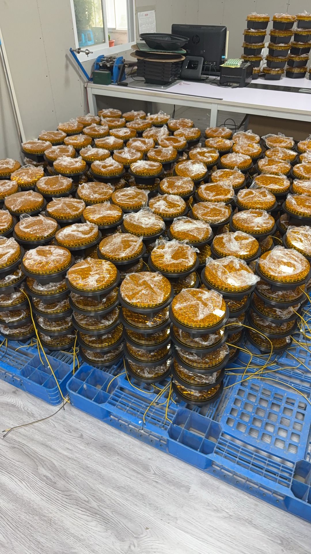 Amber LED traffic signal modules staged after assembly in the GAOQIAO workshop